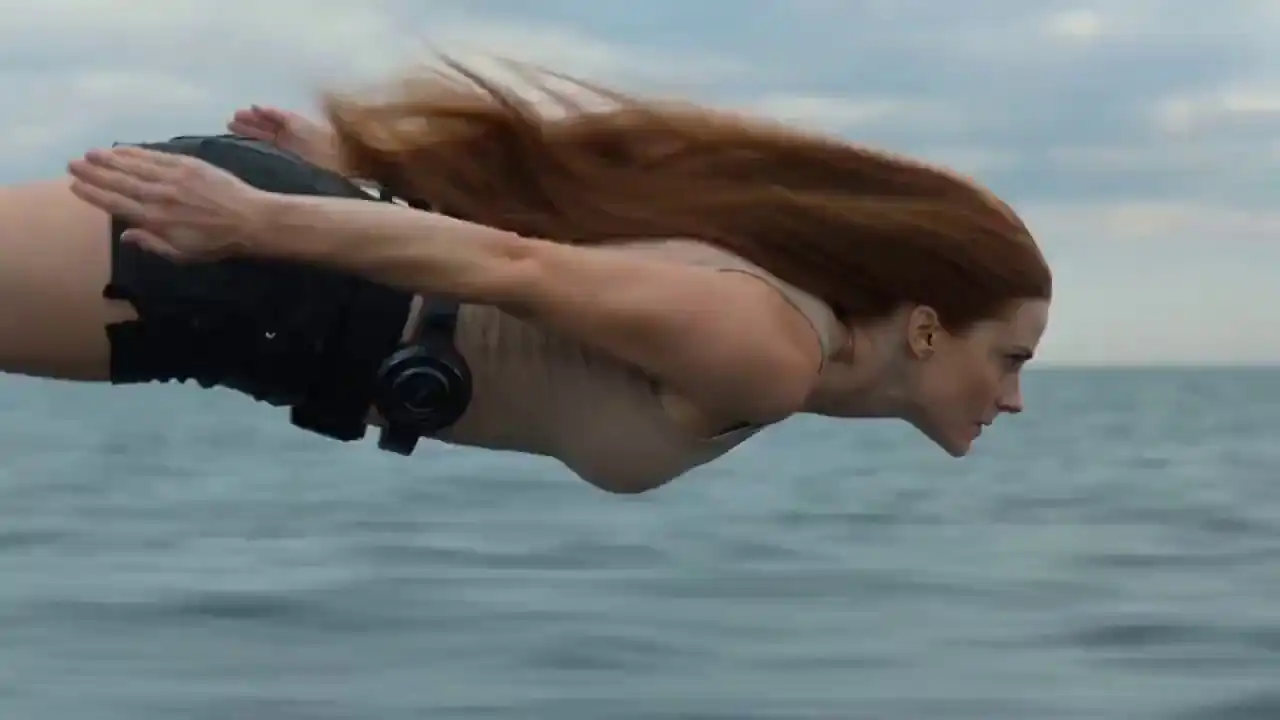 Realistic 4K action of a woman diving into water to rescue a cat with fluid simulations by Seedance 2.0.